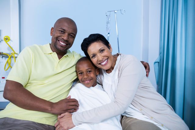 Portrait of smiling parents and patient in hospital