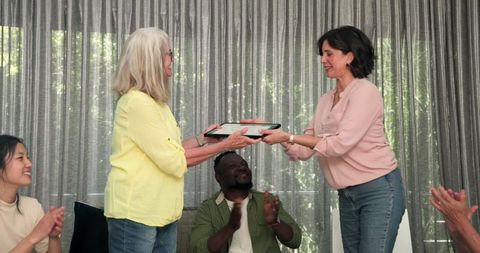 Diverse group enjoying therapy session accomplishment