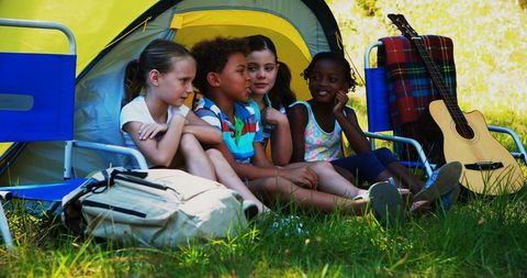 Children Enjoying Camping Adventure Amidst Nature