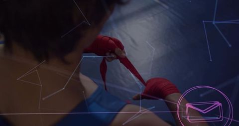 Male athlete wrapping hands with digital interface overlay