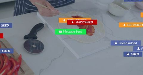 Teen spreading tomato sauce on dough in home kitchen with social media alerts