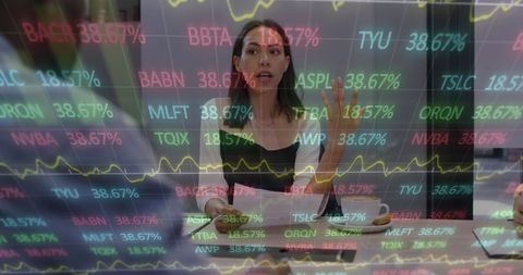 Businesswoman Analyzing Financial Data and Stock Market Trends in Office