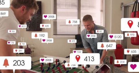 Friends competing in foosball surrounded by social media icons