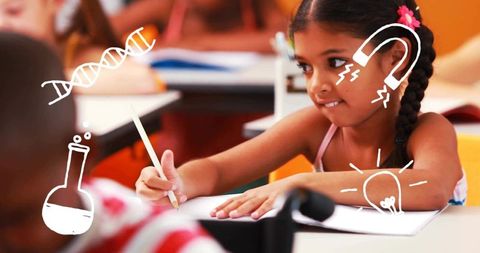 Young girl writing at school desk with playful science doodles and focused expression