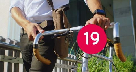 Man Walking with Bicycle in Urban Setting with Number Graphic Overlay - Download Free Stock Images Pikwizard.com