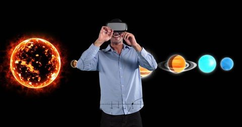 Businessman Exploring Virtual Solar System with VR Headset
