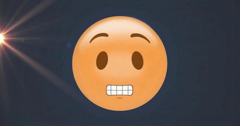Grimacing emoji showing awkward expression on dark blue gradient with lens flare for social media