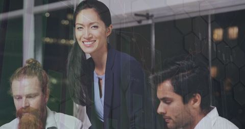 Business team collaborating over financial data