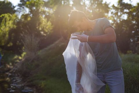 Young Volunteer Cleaning Litter at Creek Enhancing Nature Conservation Efforts