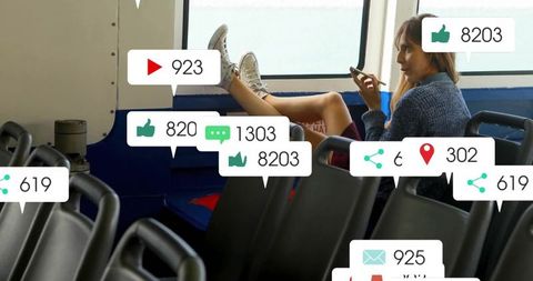 Young woman relaxing on ferry with smartphone and social media icons