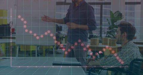 Presenting team leader with dotted data graph overlay in modern office meeting