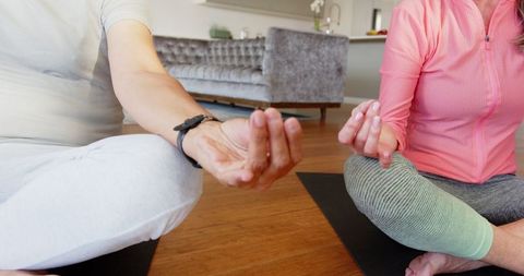 Senior Couple Meditating at Home in Peaceful Environment