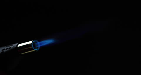 Close Up of Blue Torch Flame Against Black Background