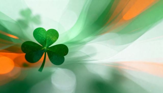 Floating shamrock with green bokeh and orange light streaks for st patrick's day design