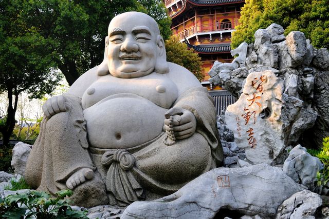 Laughing Buddha Statue in Traditional Asian Garden - Download Free Stock Photos Pikwizard.com