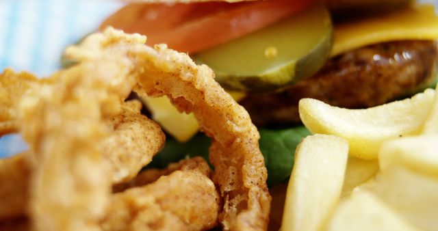 Close-up of Fast Food with Onion Rings, Burger, and Fries - Download Free Stock Images Pikwizard.com