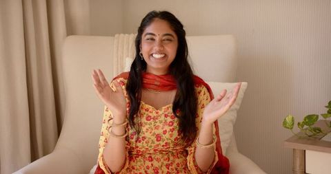 Smiling indian woman in traditional attire looking joyful