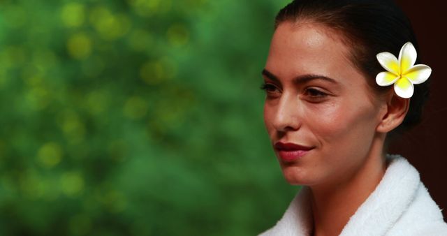 Serene Woman with Flower in Hair Relaxing Outdoors - Download Free Stock Images Pikwizard.com