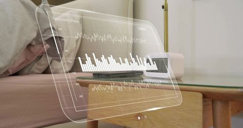 Holographic analytics dashboard hovering over minimalist nightstand with smartphone