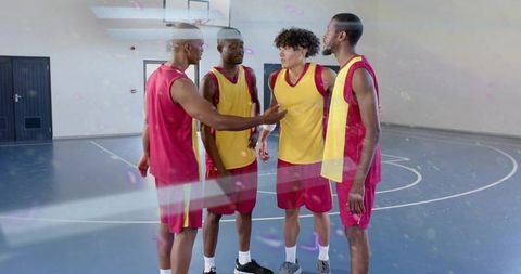 Basketball Teammates Strategizing During Game Break