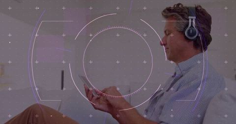 Man Using Tablet with Headset in Modern Digital Environment