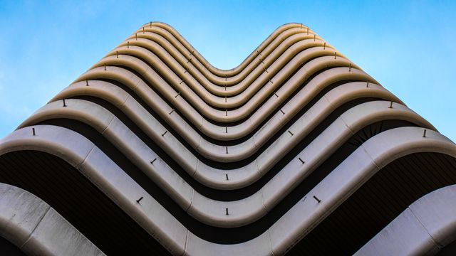 Modern Architectural Building with Curved Facade - Download Free Stock Photos Pikwizard.com
