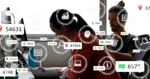 Woman writing at desk amid floating digital notifications and data visualization overlays