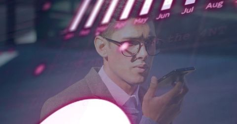 Executive speaking into smartphone with neon data overlay and futuristic reflections