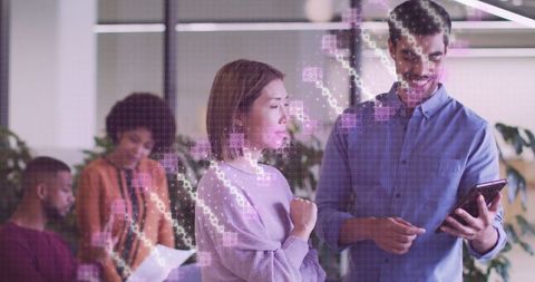 Diverse Coworkers Exploring Digital DNA Concept in Modern Office