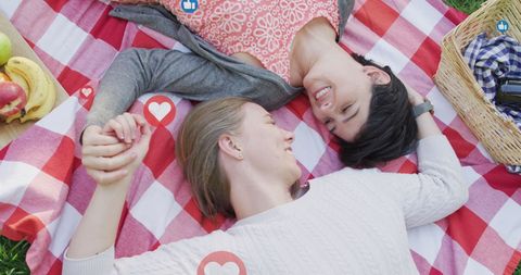 Romantic picnic between smiling couple outdoors