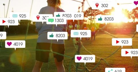 Goalkeeper on Field Among Social Media Like Icons and Tracking Symbols