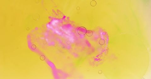 Colorful abstract liquid dynamics on yellow background