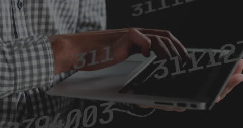 Hands of Man Typing on Laptop Amidst Digital Code