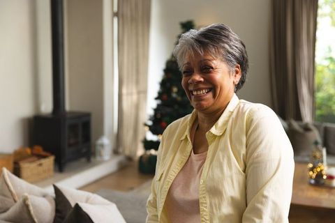 Cheerful Senior Woman Enjoying Festive Season at Home
