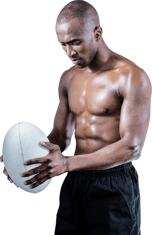 Focused shirtless athlete holding rugby ball transparent background