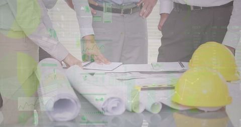 Architects Analyzing Blueprints with Overlaid Financial Data - Download Free Stock Images Pikwizard.com