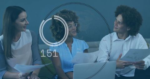 Diverse Team Analyzing Data and Collaborating on Project Strategy