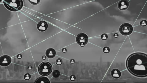 Abstract Network of Profile Icons Over Cityscape