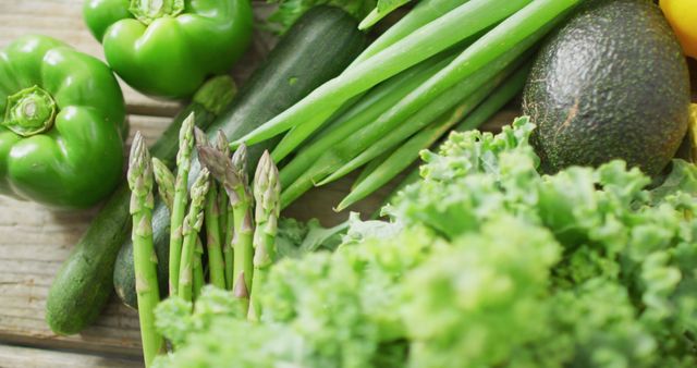 Assorted Fresh Green Vegetables on Wooden Surface - Download Free Stock Photos Pikwizard.com
