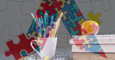 Pencils and books with puzzle overlay symbolizing autism awareness
