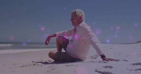 Elderly Man Relaxing on Serene Beach with Calming Lavender Lights