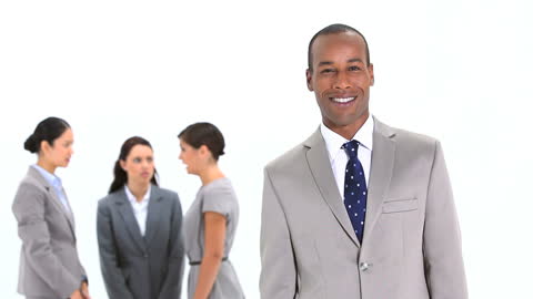 Confident Businessman Smiling in Professional Workspace