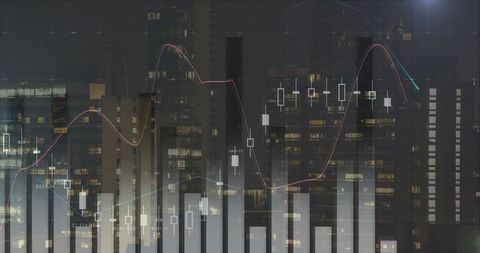 Digital financial graphs overlay city buildings at night