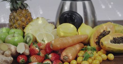 Displaying colorful fresh fruit with stainless blender and digital binary overlay