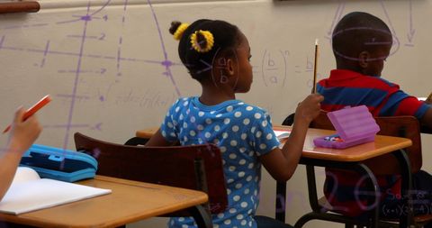 Students Engaged in Mathematics Class with Formulas Overlay - Download Free Stock Images Pikwizard.com