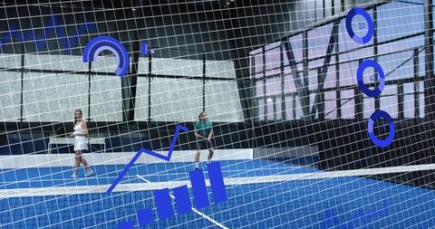 Duo Playing Tennis on Blue Indoor Court with Performance Analytics Overlay and HUD