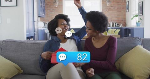 Mother and Daughter Sharing Joyful Moment with Gift