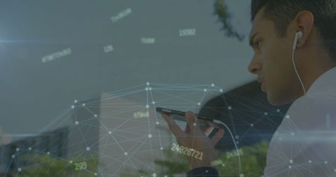Young professional using smartphone with virtual data overlay