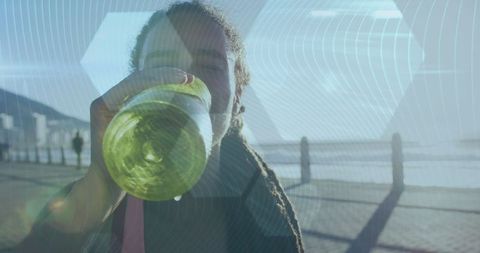 African american woman hydrating on sunny promenade