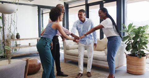 Diverse Team Cheering Celebrating Success in Modern Office